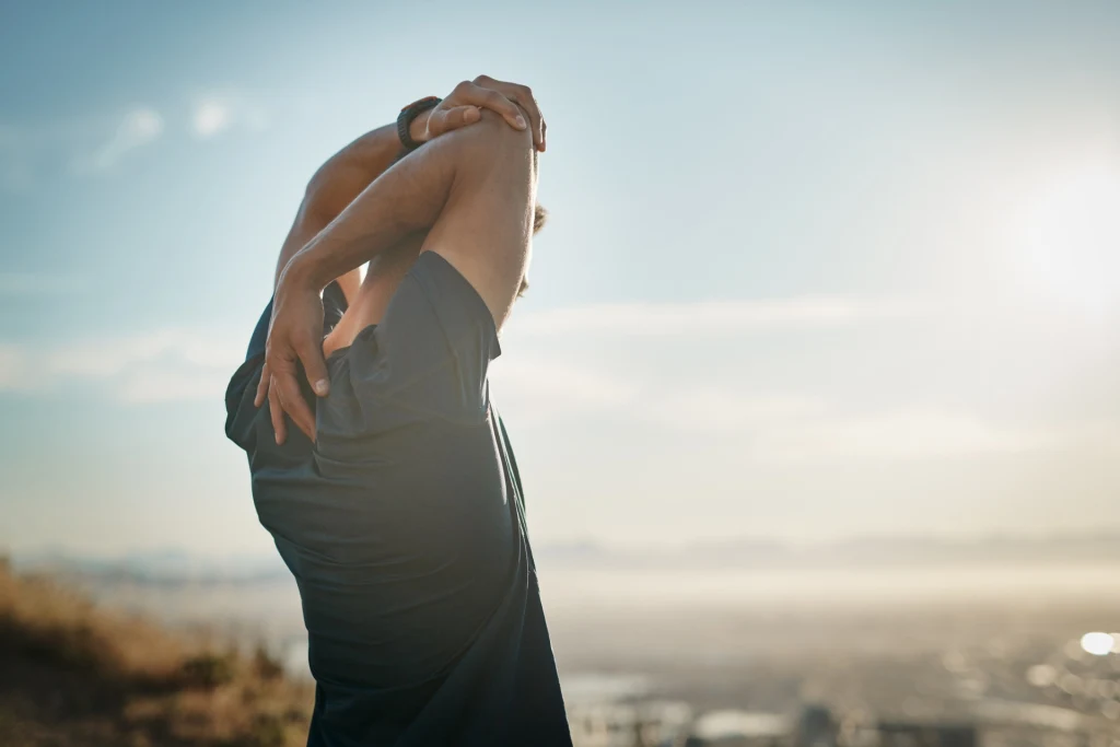 man stretching his arms